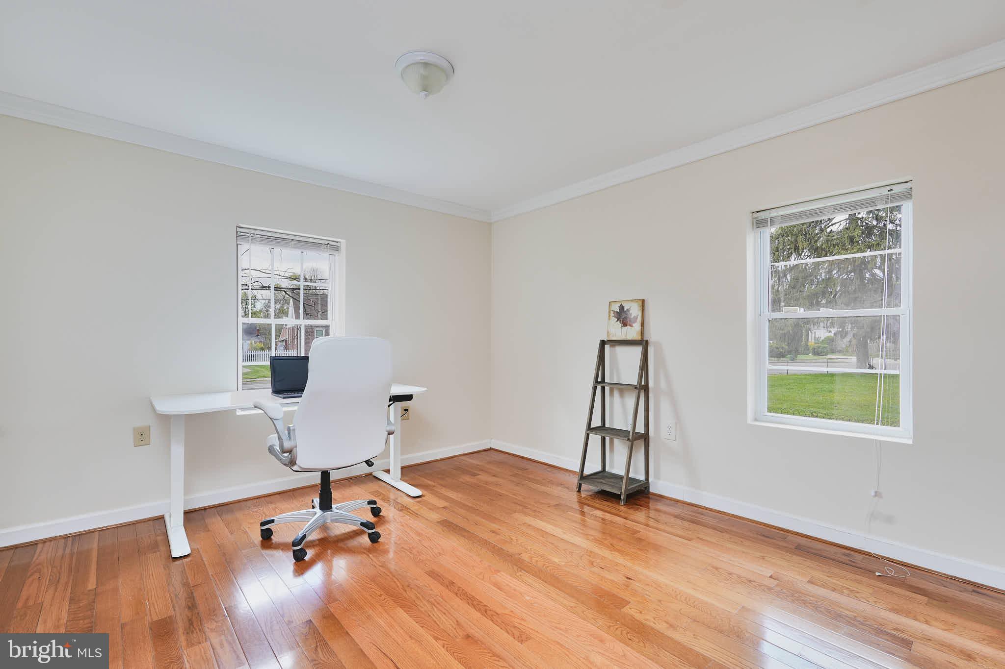 3318 Memorial Street Alexandria, VA 22306 - Photo 16 of 49 a view of a workspace with furniture and a window