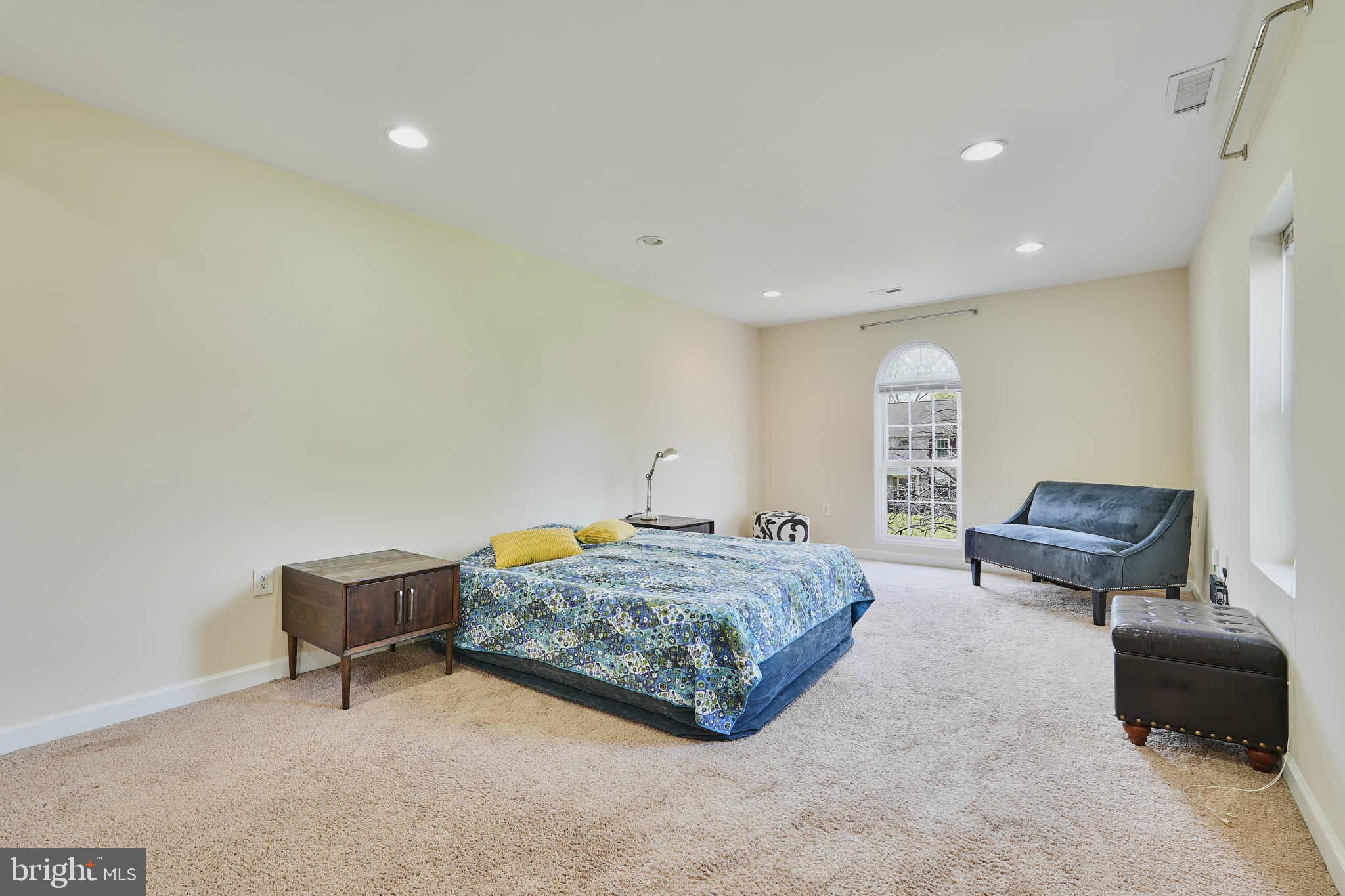 3318 Memorial Street Alexandria, VA 22306 - Photo 19 of 49 a bedroom with a bed and a mirror