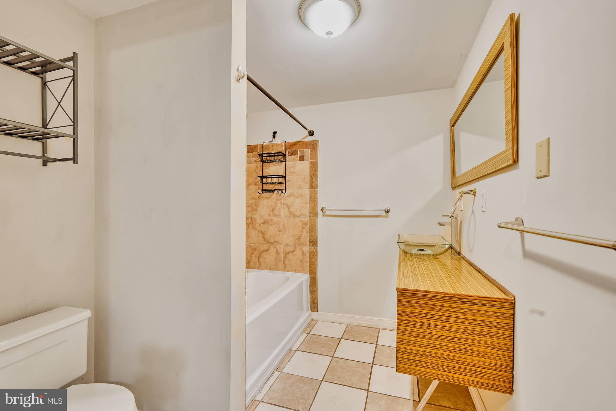 3318 Memorial Street Alexandria, VA 22306 - Photo 25 of 49 a bathroom with a toilet and a shower