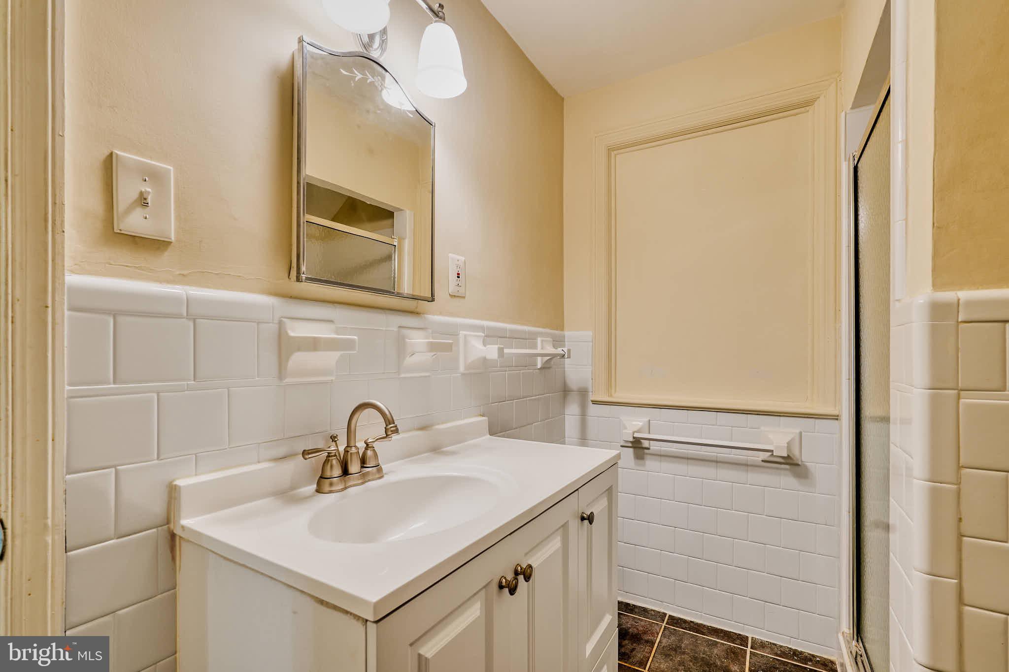 3318 Memorial Street Alexandria, VA 22306 - Photo 28 of 49 a bathroom with a sink and a mirror