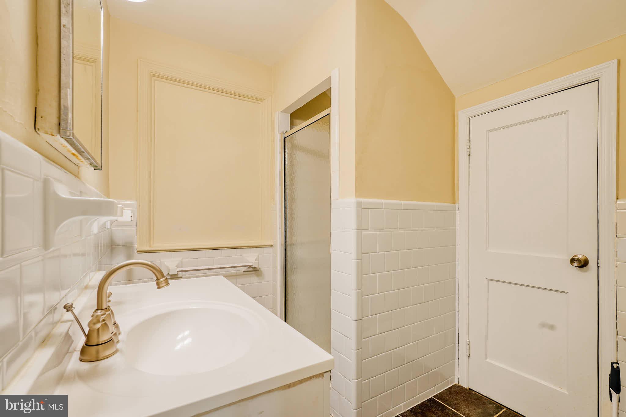 3318 Memorial Street Alexandria, VA 22306 - Photo 29 of 49 a bathroom with a sink and a mirror
