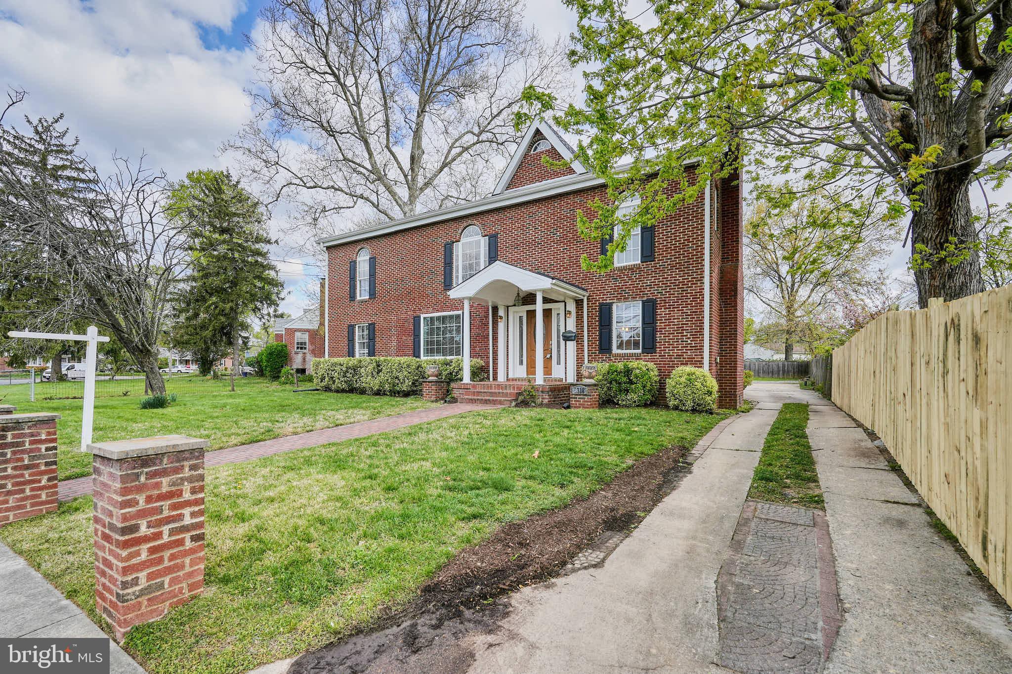 3318 Memorial Street Alexandria, VA 22306 - Photo 42 of 49 a front view of a house with yard and green space