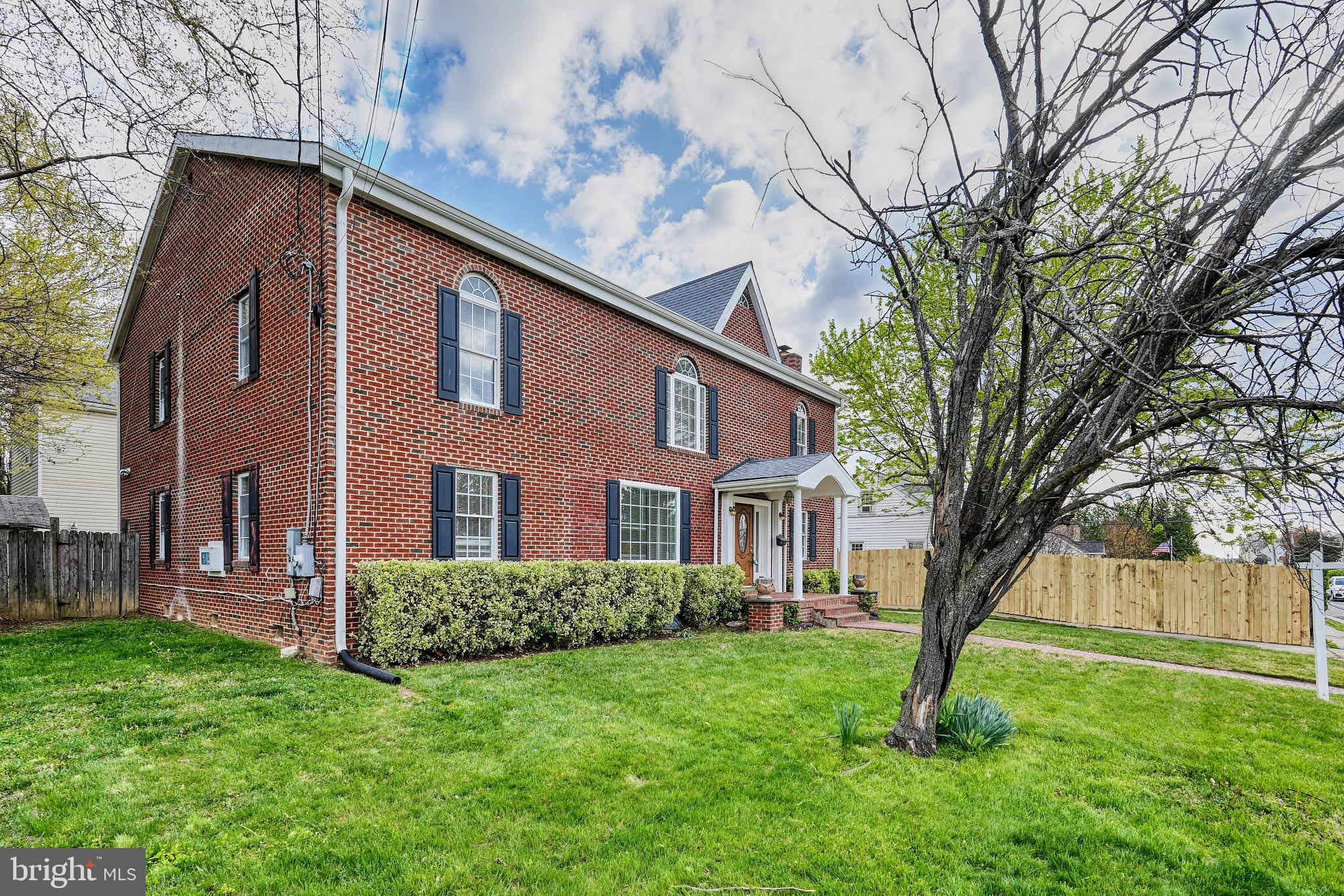 3318 Memorial Street Alexandria, VA 22306 - Photo 43 of 49 a front view of a house with a yard