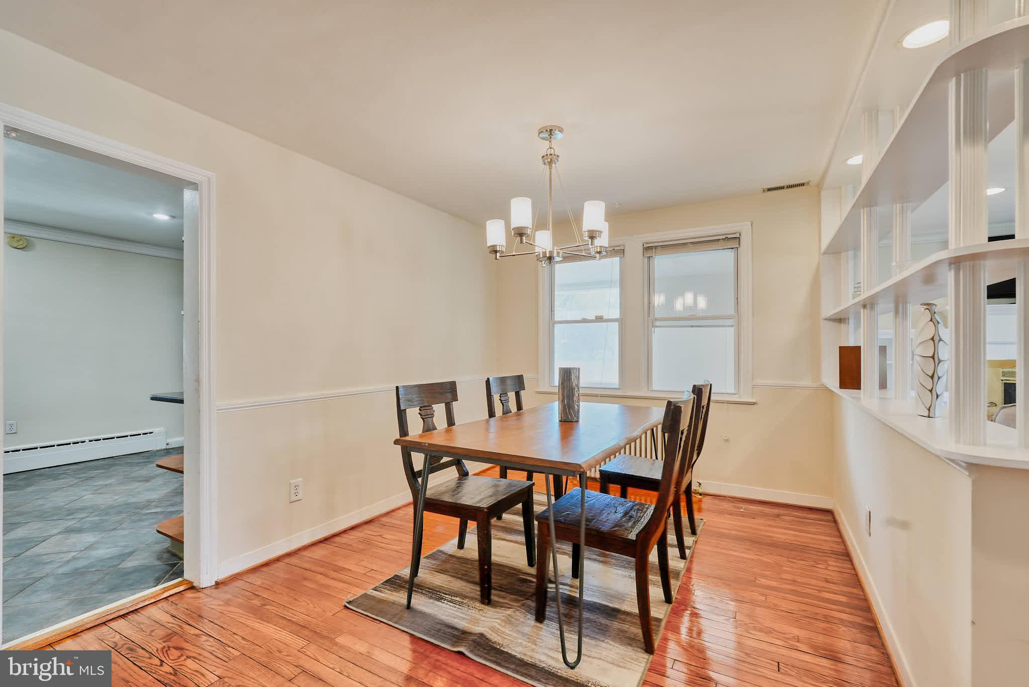 3318 Memorial Street Alexandria, VA 22306 - Photo 5 of 49 a view of a dining room with furniture and wooden floor