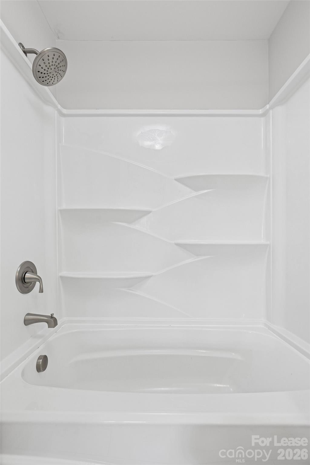 113 Stroupe Road, Unit E Gastonia, NC 28056 - Photo 22 of 32 a bathroom with a bathtub