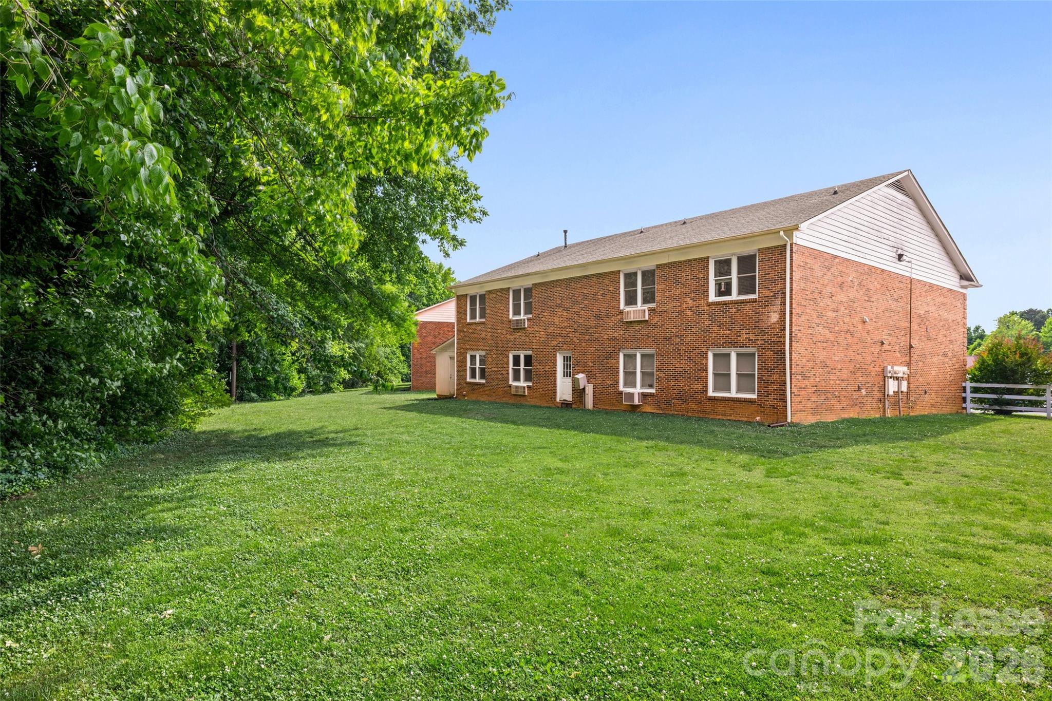 113 Stroupe Road, Unit E Gastonia, NC 28056 - Photo 25 of 32 a view of a house with backyard and garden