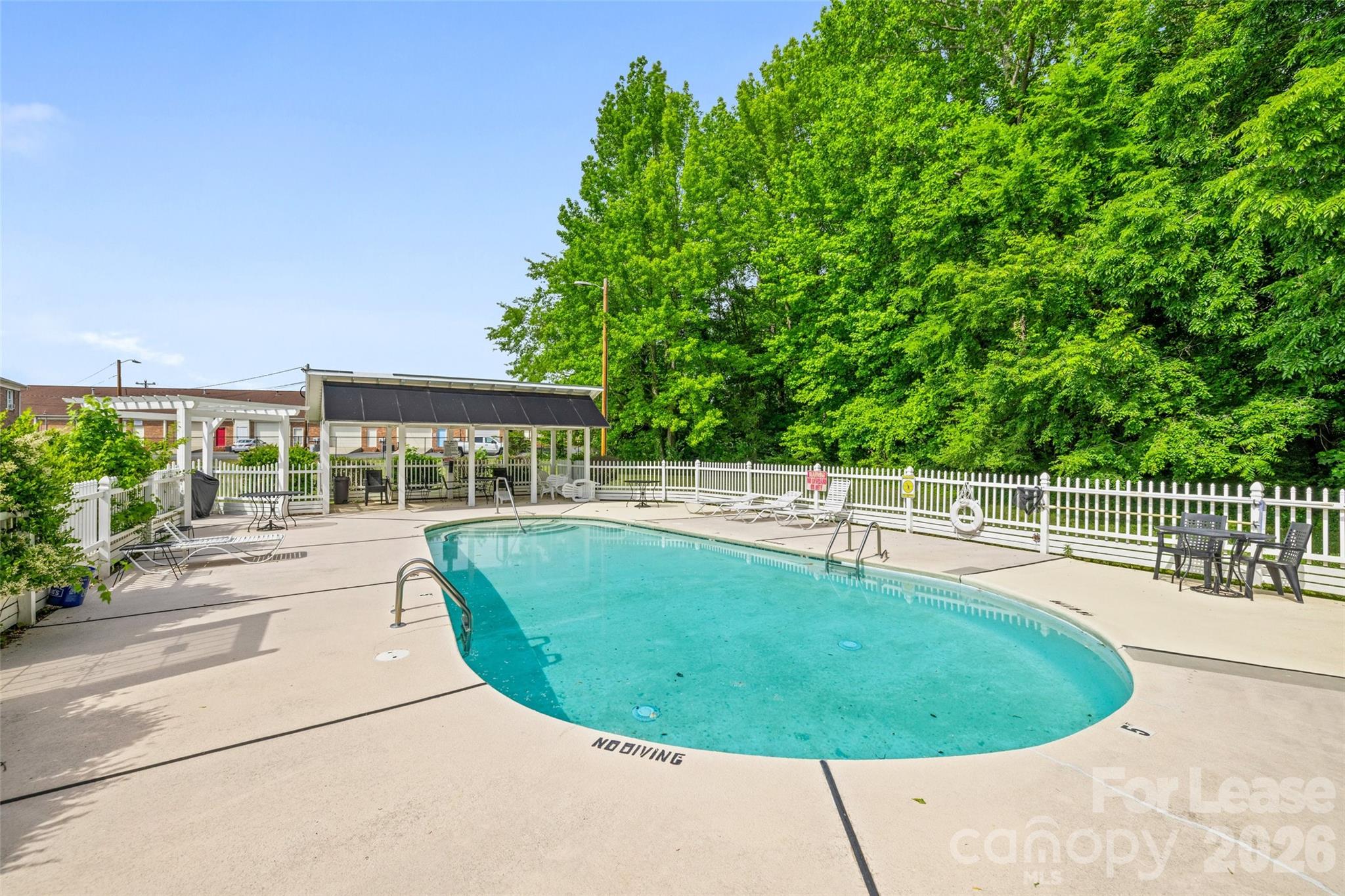 113 Stroupe Road, Unit E Gastonia, NC 28056 - Photo 29 of 32 a view of a swimming pool with a balcony