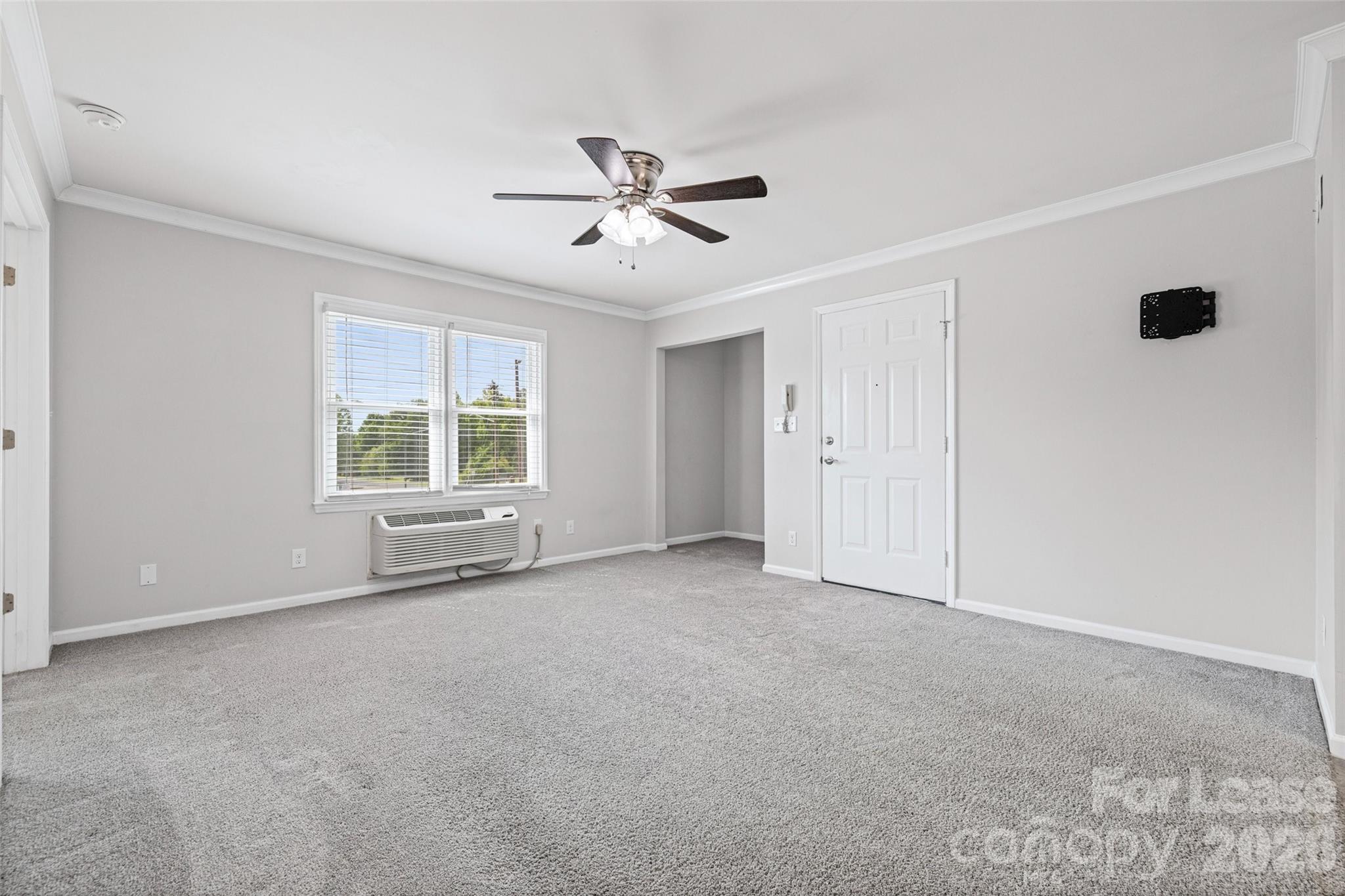 113 Stroupe Road, Unit E Gastonia, NC 28056 - Photo 9 of 32 a view of an empty room with a window