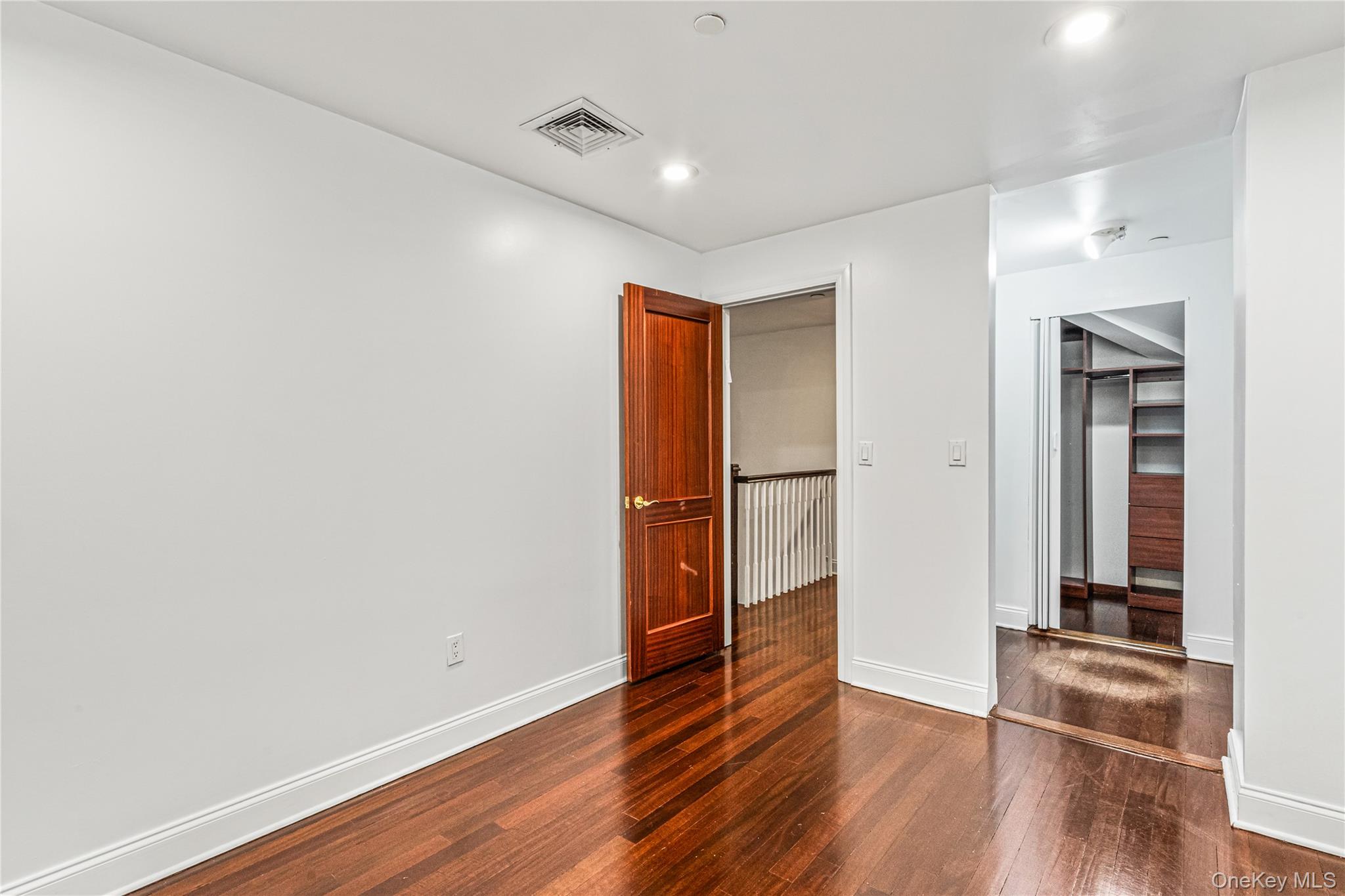 171 Great Neck Road, Unit 4R Great Neck, NY 11021 - Photo 17 of 27 a view of empty room with wooden floor