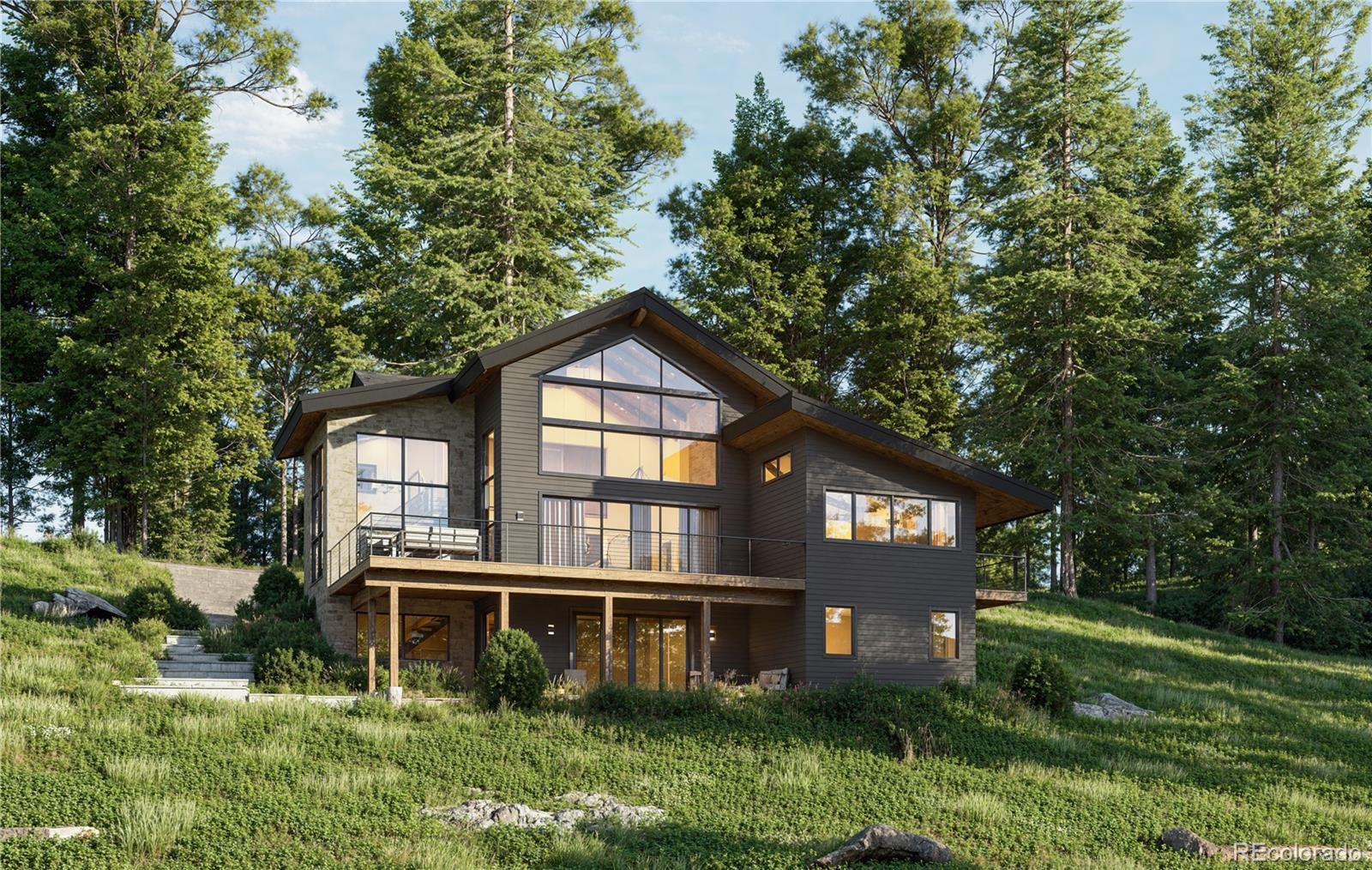 31334 Forest Shadow Trail Conifer, CO 80433 - Photo 2 of 16 a front view of a house with a yard