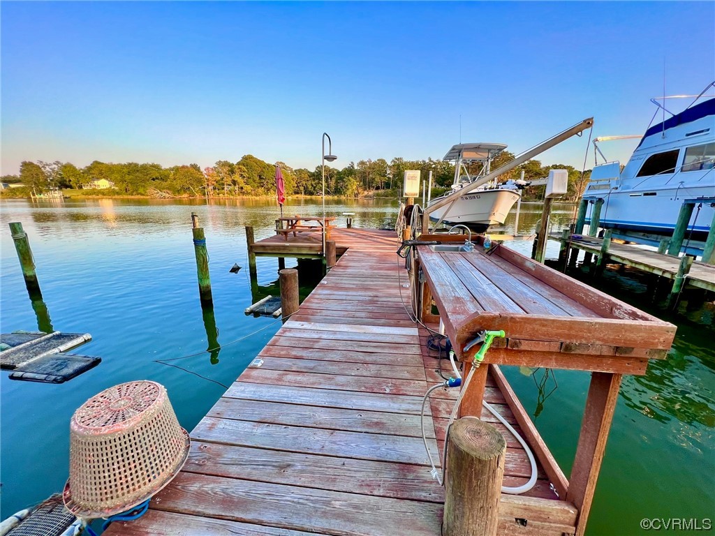 142 Circle Drive Deltaville, VA 23043 - Photo 11 of 49 a front view of a house with outdoor seating