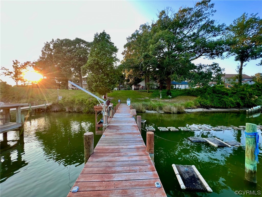 142 Circle Drive Deltaville, VA 23043 - Photo 14 of 49 a view of a lake with a garden