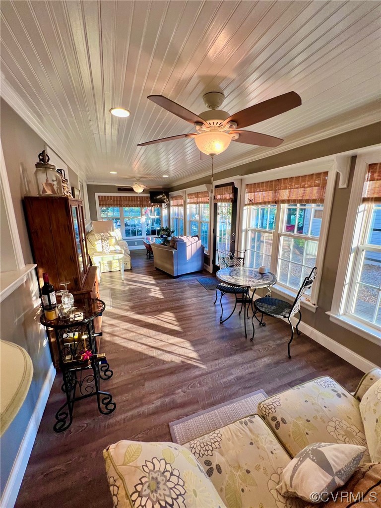 142 Circle Drive Deltaville, VA 23043 - Photo 15 of 49 a living room with furniture a rug and a chandelier