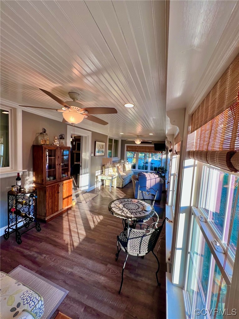 142 Circle Drive Deltaville, VA 23043 - Photo 18 of 49 a living room with lots of furniture and a book shelf