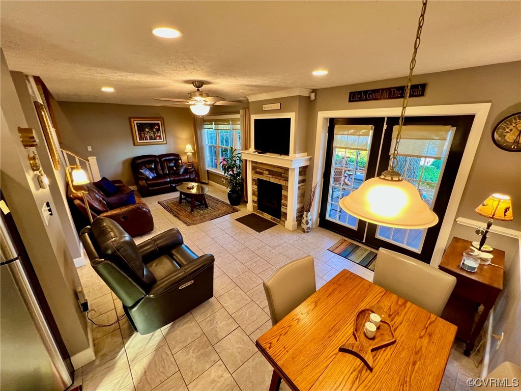 142 Circle Drive Deltaville, VA 23043 - Photo 22 of 49 a living room with furniture a flat screen tv and a fireplace