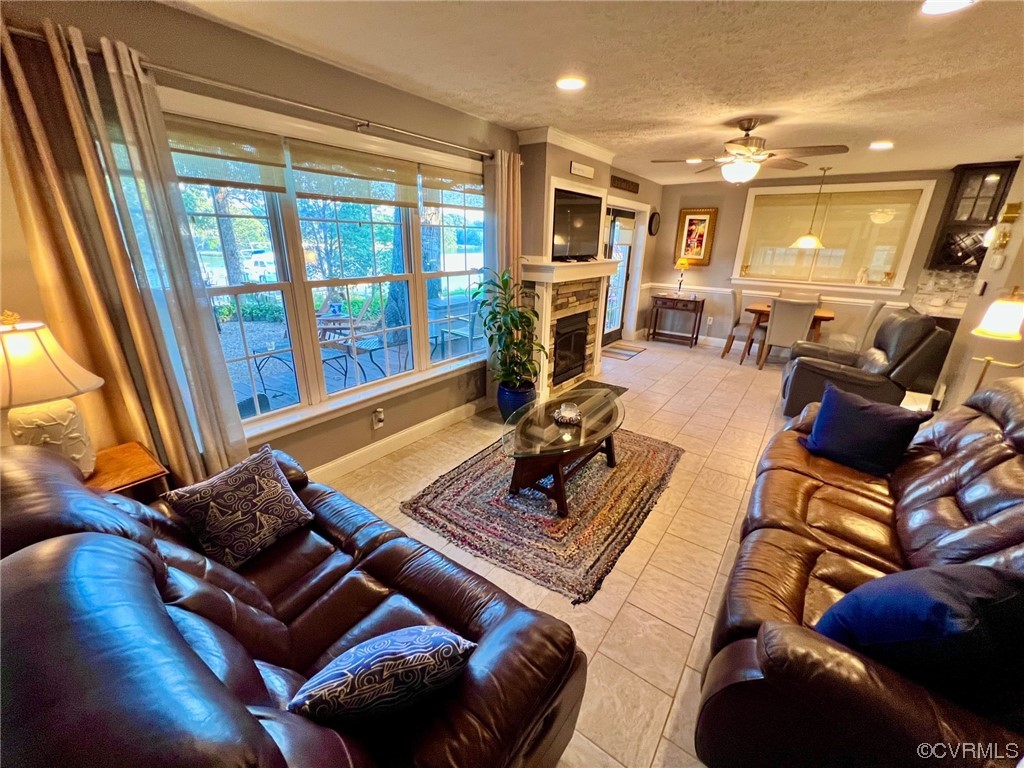 142 Circle Drive Deltaville, VA 23043 - Photo 24 of 49 a living room with furniture a flat screen tv and a large window