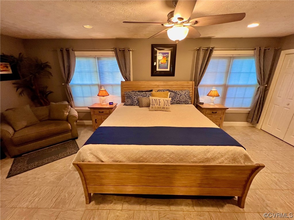 142 Circle Drive Deltaville, VA 23043 - Photo 27 of 49 a bedroom with a large bed and a couch
