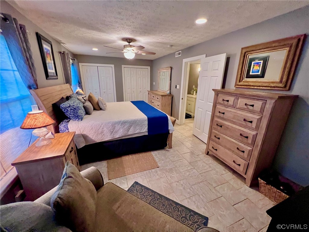 142 Circle Drive Deltaville, VA 23043 - Photo 28 of 49 a bedroom with furniture and wooden floor