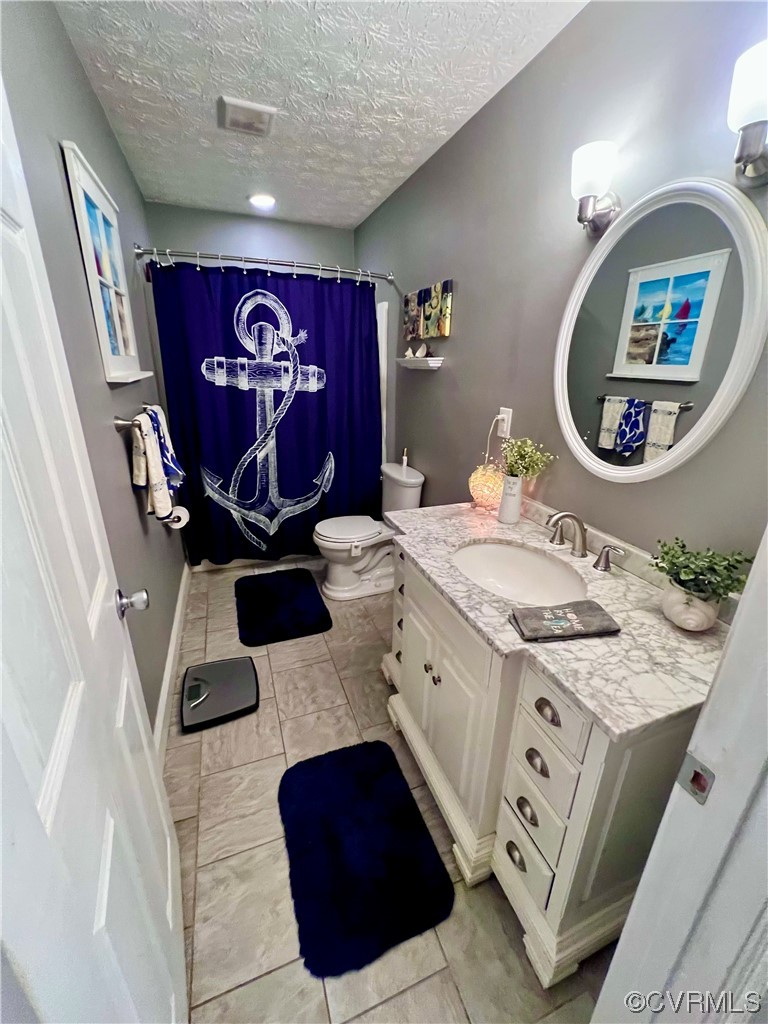 142 Circle Drive Deltaville, VA 23043 - Photo 31 of 49 a bathroom with a sink mirror and vanity