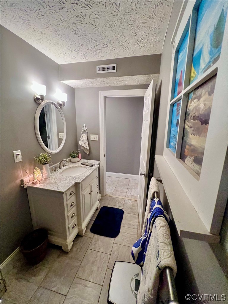 142 Circle Drive Deltaville, VA 23043 - Photo 32 of 49 a bathroom with a sink vanity mirror and tub