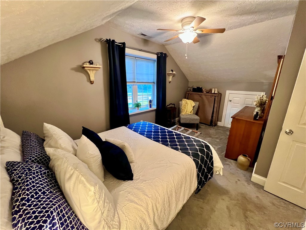 142 Circle Drive Deltaville, VA 23043 - Photo 38 of 49 a bedroom with bed and wooden floor