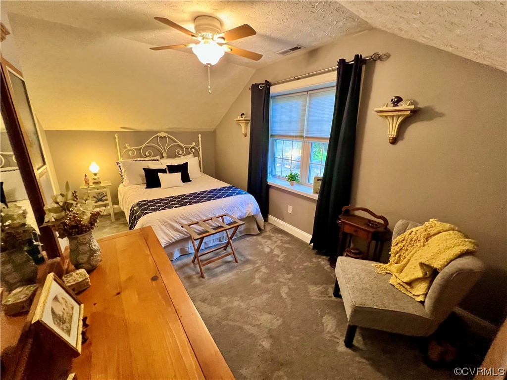 142 Circle Drive Deltaville, VA 23043 - Photo 39 of 49 a bedroom with a bed and wooden floor