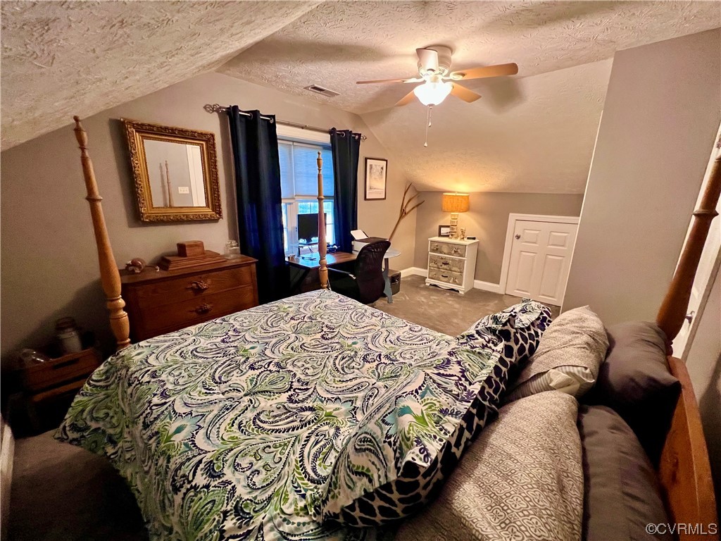 142 Circle Drive Deltaville, VA 23043 - Photo 41 of 49 a bed sitting in a bedroom next to a window