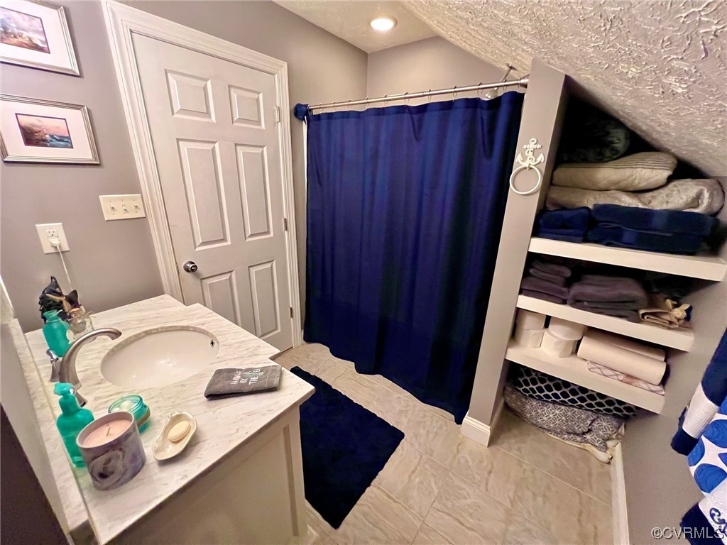 142 Circle Drive Deltaville, VA 23043 - Photo 43 of 49 a bedroom with a bed and a dresser