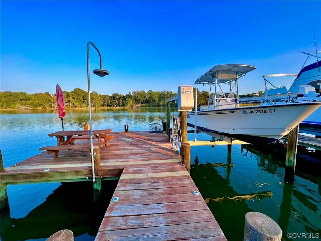 142 Circle Drive Deltaville, VA 23043 - Photo 10 of 49 a view of a lake with a table and chairs