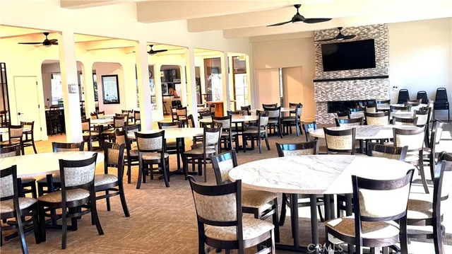 a view of a dining room with furniture window and a fireplace
