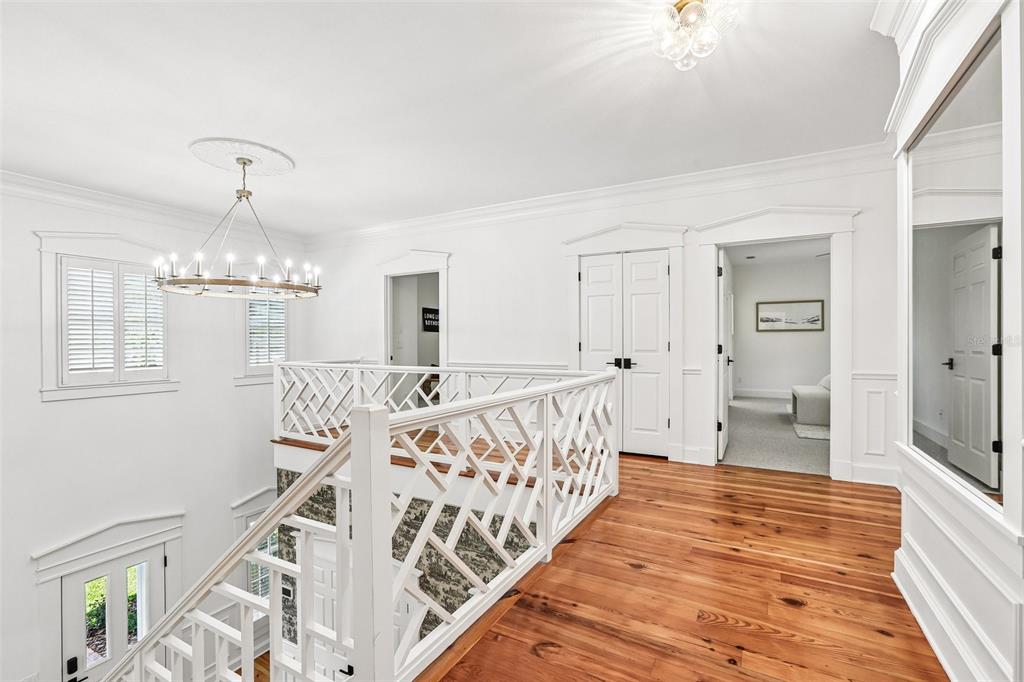1012 Morfield Lane Brandon, FL 33511 - Photo 62 of 100 a view of a hallway with wooden floor and staircase