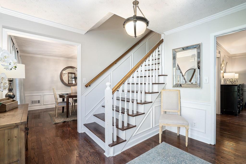 4682 Bentley Place Peachtree Corners, GA 30096 - Photo 11 of 44 a view of entryway dining room and hall with wooden floor