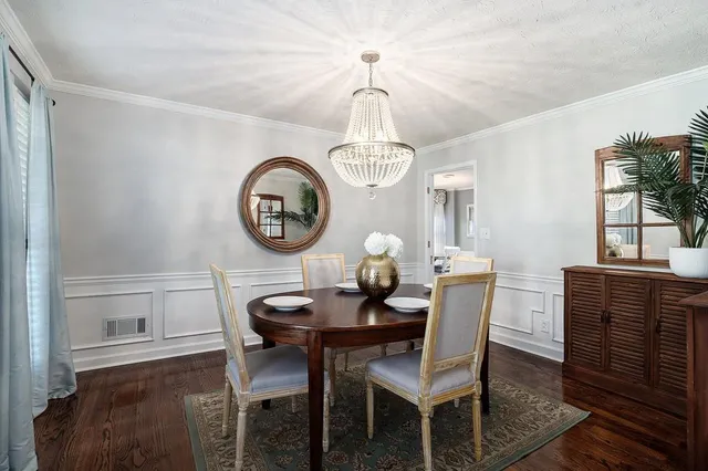 a kitchen with granite countertop a sink stove and cabinets