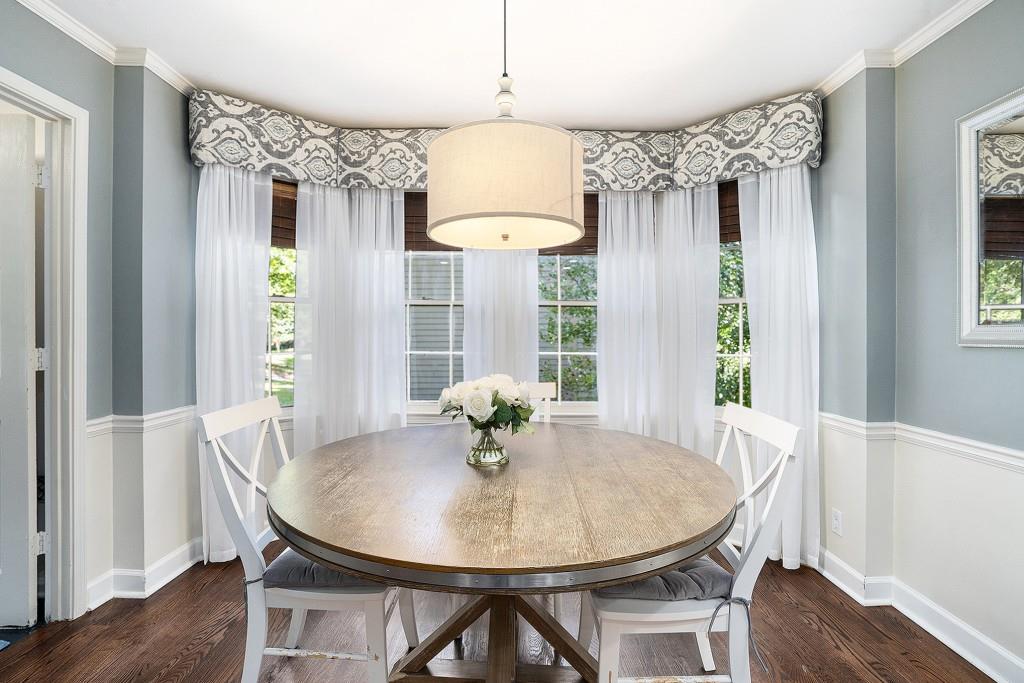 4682 Bentley Place Peachtree Corners, GA 30096 - Photo 17 of 44 a view of a dining room with furniture window and wooden floor