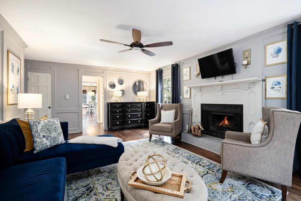 4682 Bentley Place Peachtree Corners, GA 30096 - Photo 18 of 44 a living room with furniture and a fireplace