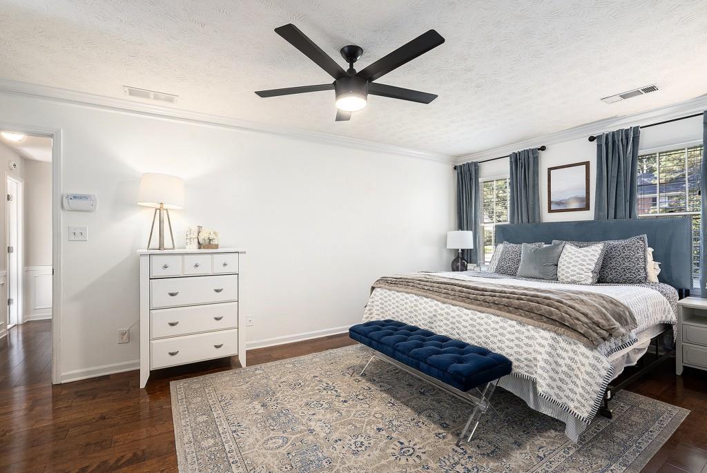 4682 Bentley Place Peachtree Corners, GA 30096 - Photo 24 of 44 a spacious bedroom with a bed and a dresser