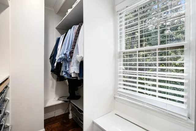 a bathroom with a sink bathtub and a window