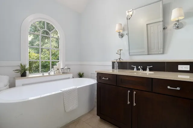 a bathroom with a shower a sink and a shower
