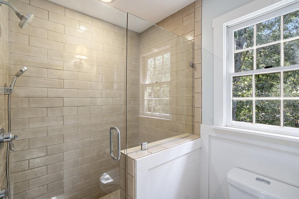 4682 Bentley Place Peachtree Corners, GA 30096 - Photo 28 of 44 a bathroom with a shower a sink and a shower