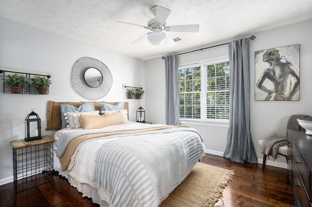 4682 Bentley Place Peachtree Corners, GA 30096 - Photo 29 of 44 a bedroom with a bed and a window