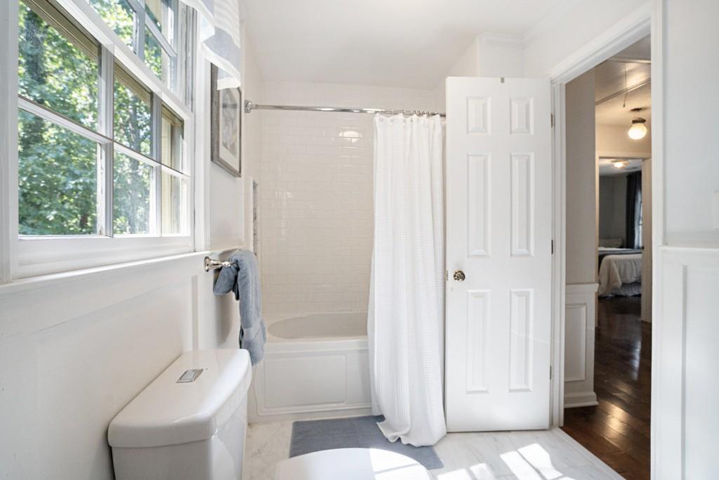 4682 Bentley Place Peachtree Corners, GA 30096 - Photo 36 of 44 a bathroom with a shower and a toilet