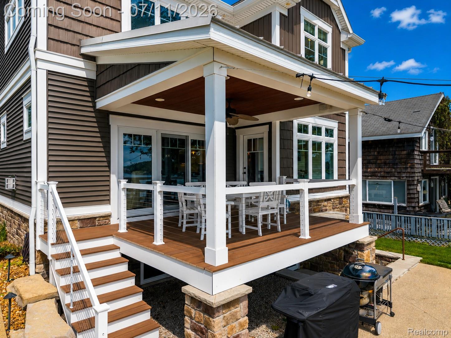 12033 Torrey Road Fenton, MI 48430 - Photo 45 of 51 Covered outdoor deck with wood-finish flooring and white railings