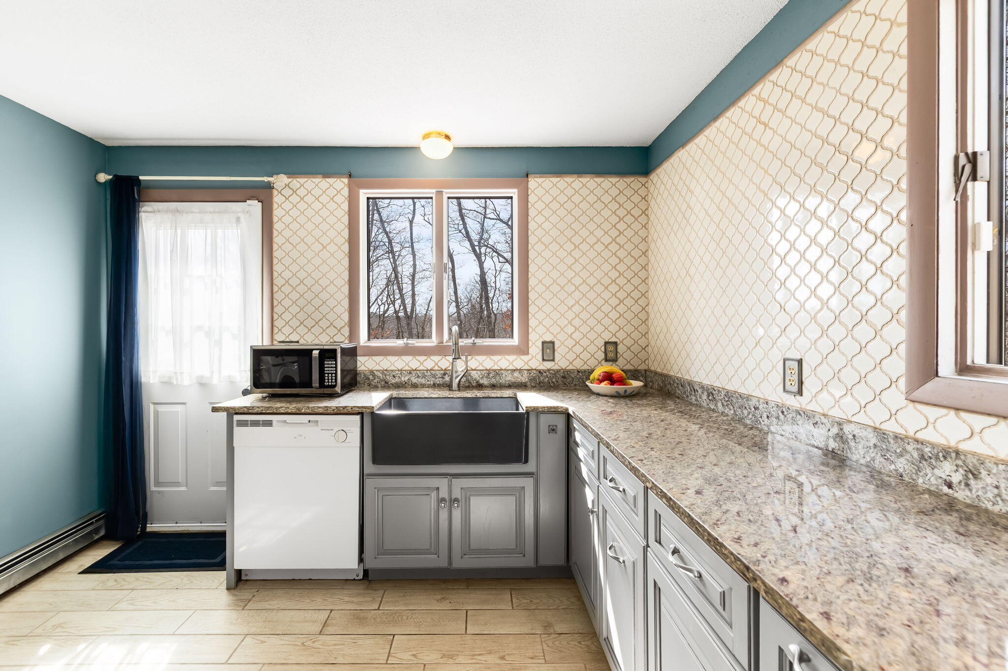 21 Braeside Road Falmouth, MA 02540 - Photo 12 of 43 a kitchen with a sink stove top oven and microwave