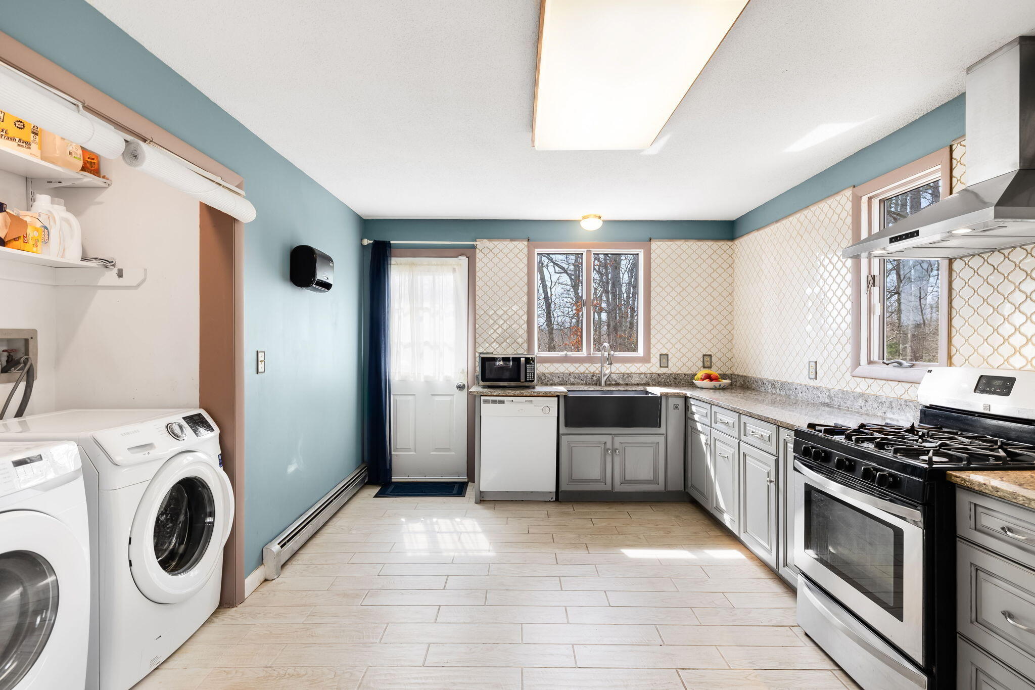 21 Braeside Road Falmouth, MA 02540 - Photo 14 of 43 a kitchen with a stove top oven sink and cabinets