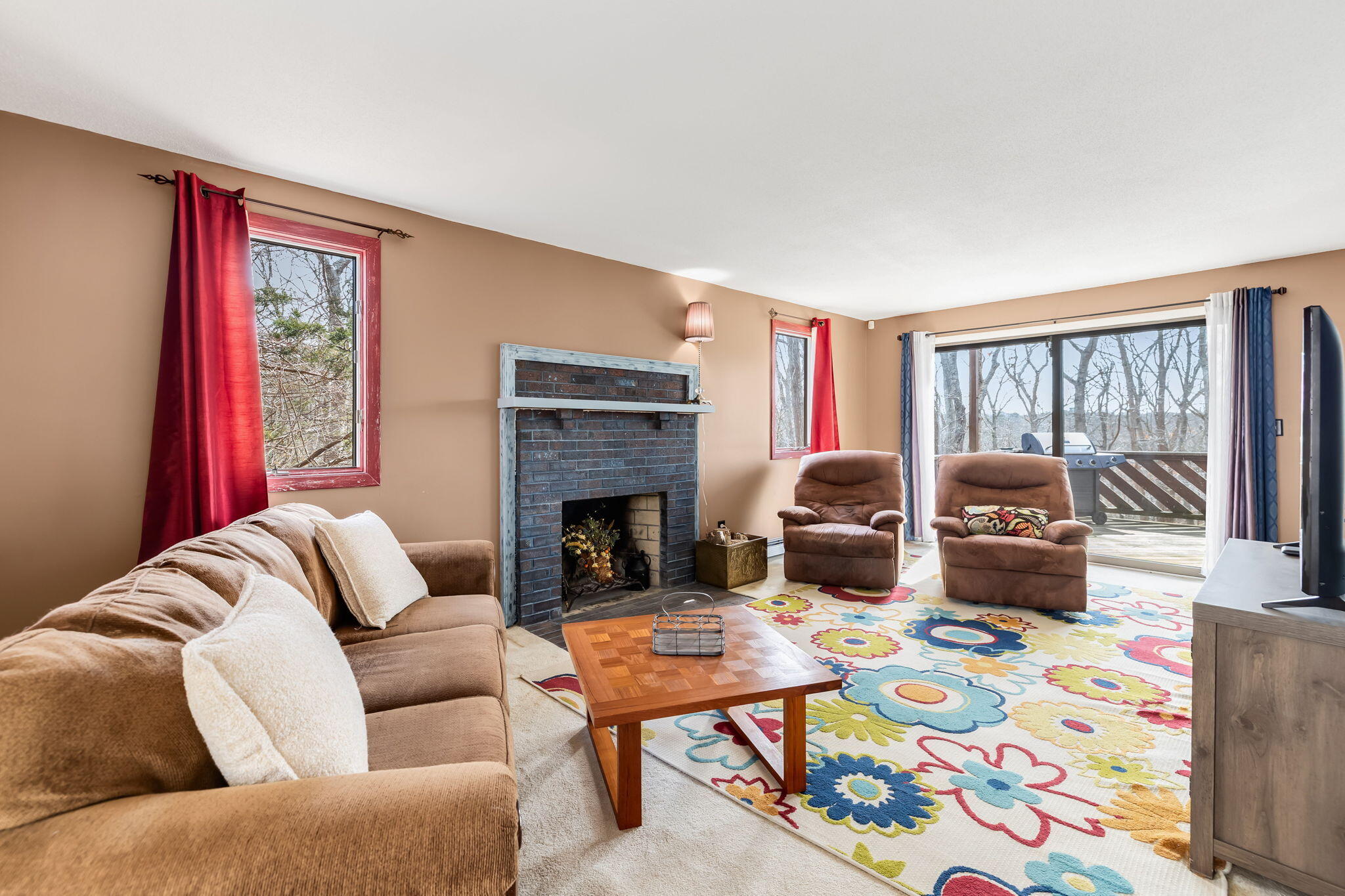 21 Braeside Road Falmouth, MA 02540 - Photo 17 of 43 a living room with furniture fireplace and flat screen tv