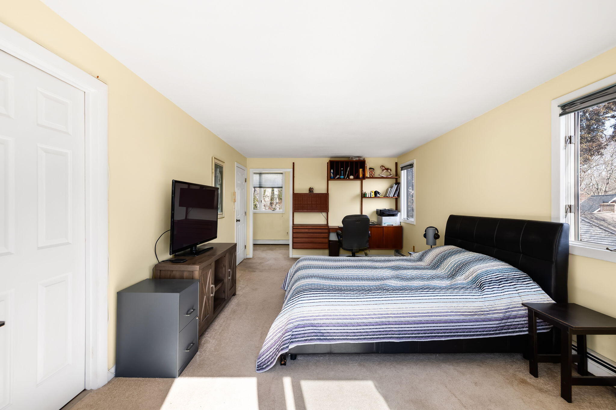 21 Braeside Road Falmouth, MA 02540 - Photo 24 of 43 a bedroom with a bed and a flat screen tv