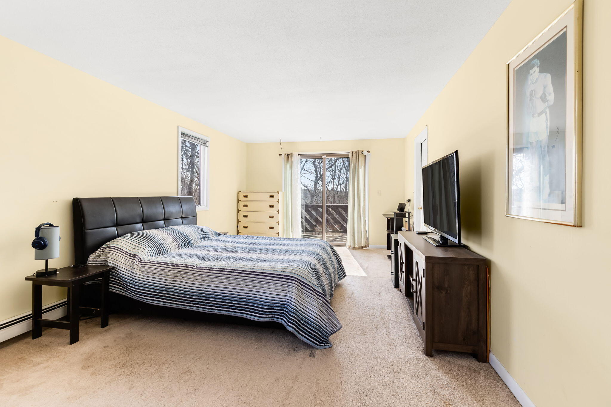 21 Braeside Road Falmouth, MA 02540 - Photo 25 of 43 a bedroom with a bed and flat screen tv