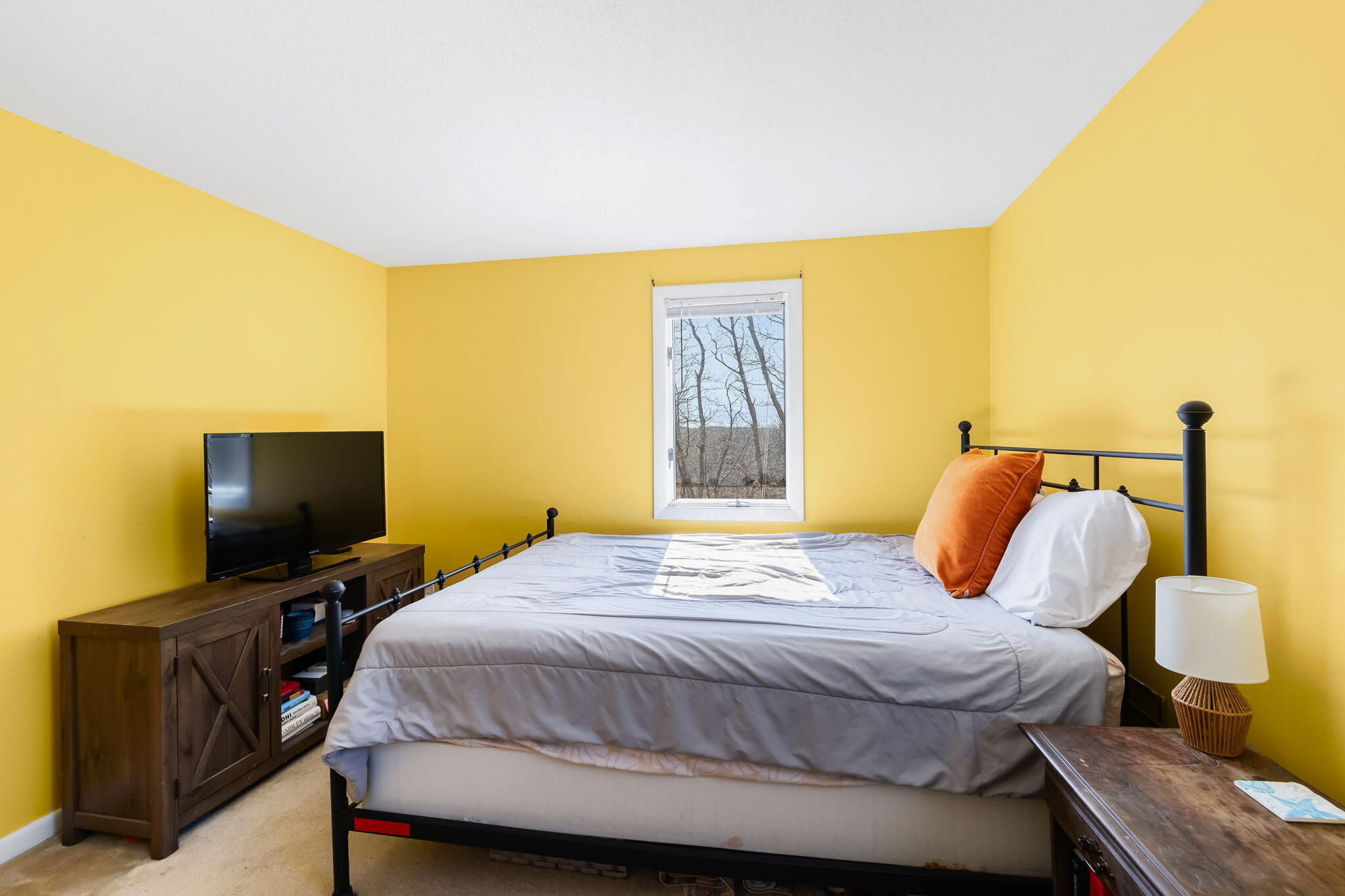 21 Braeside Road Falmouth, MA 02540 - Photo 31 of 43 a bedroom with a bed and flat screen tv