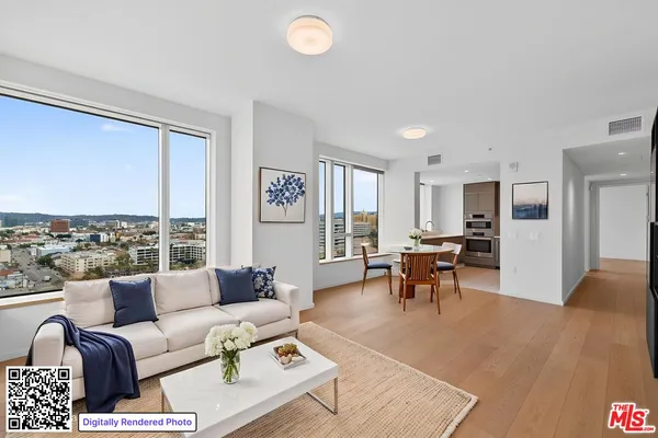 a living room with furniture potted plant and a large window