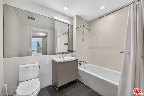 a bathroom with a toilet sink and bathtub